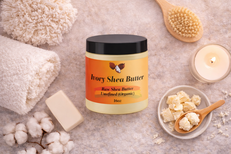 Jar of Ivory Shea Butter with shea butter, soap, and other products on a textured surface.